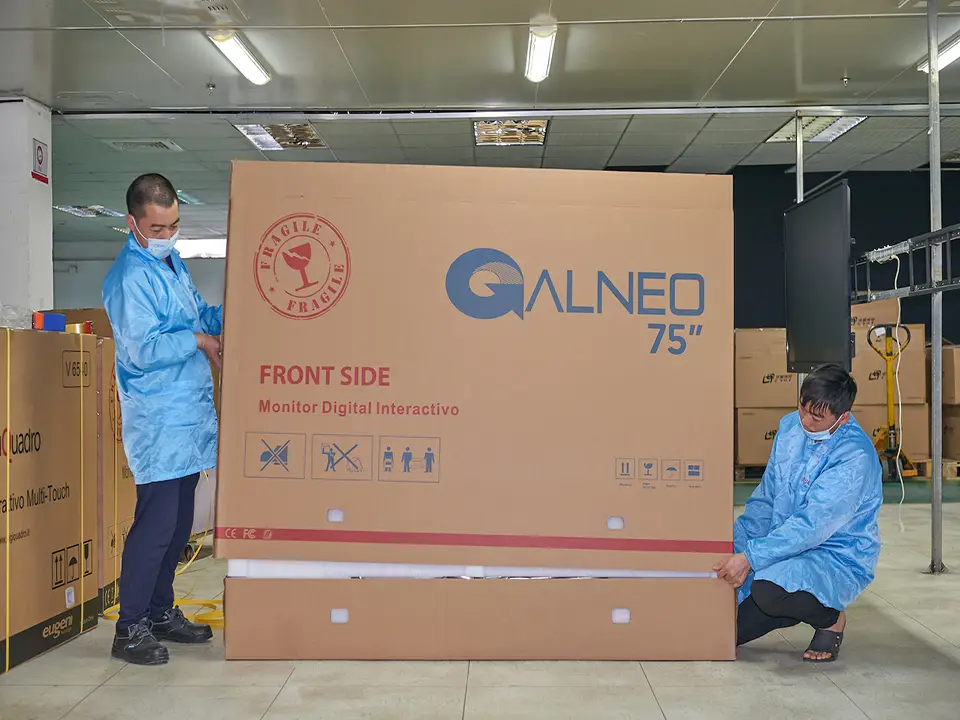 Riotouch IFPD factory assembly line — workers performing SKD pre-assembly and QC testing